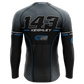 A long-sleeve athletic jersey shown from the back on a black background. The jersey is primarily black and dark gray with white and blue graphics, featuring the number 143, the name KEIGHLEY, and sponsor logos including Cycle Smith Track Cars.