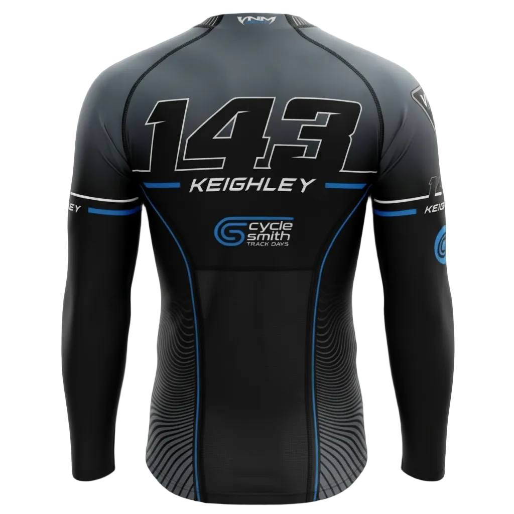 A long-sleeve athletic jersey shown from the back on a black background. The jersey is primarily black and dark gray with white and blue graphics, featuring the number 143, the name KEIGHLEY, and sponsor logos including Cycle Smith Track Cars.