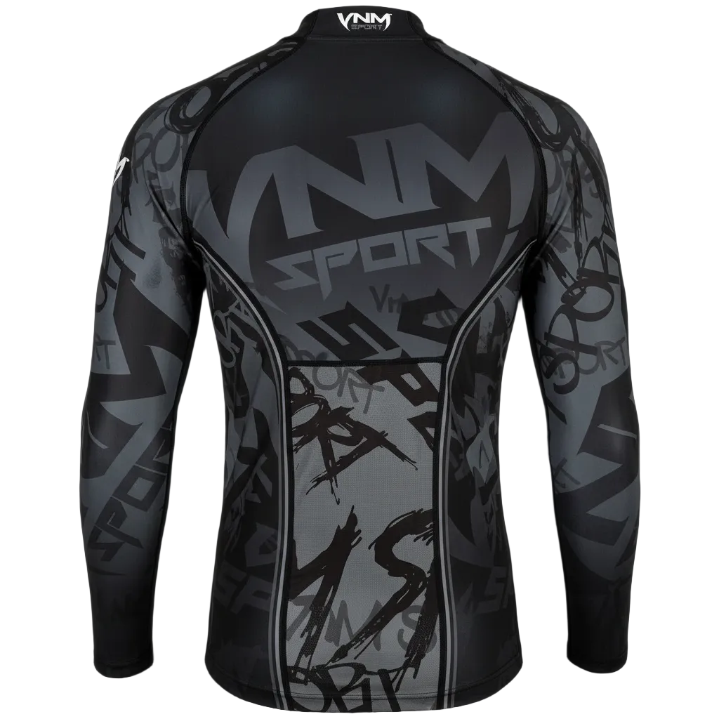 A long-sleeve athletic compression shirt shown from the back, featuring a black and gray graphic design with 'VNM SPORT' printed across the upper back and a subtle graffiti-style pattern throughout.