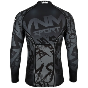 A long-sleeve athletic compression shirt shown from the back, featuring a black and gray graphic design with 'VNM SPORT' printed across the upper back and a subtle graffiti-style pattern throughout.